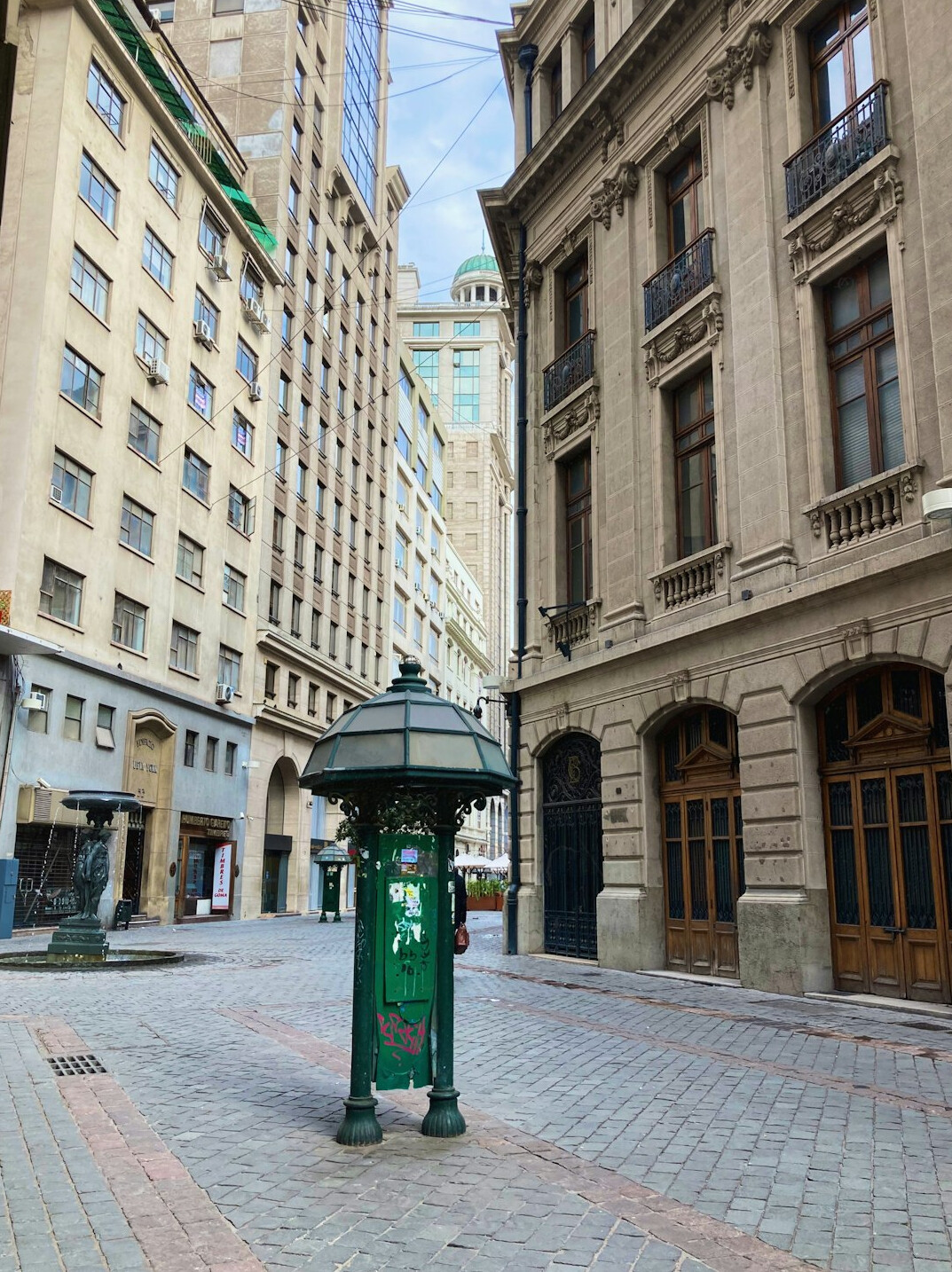 Photographer taking a picture of a street scene in Chile