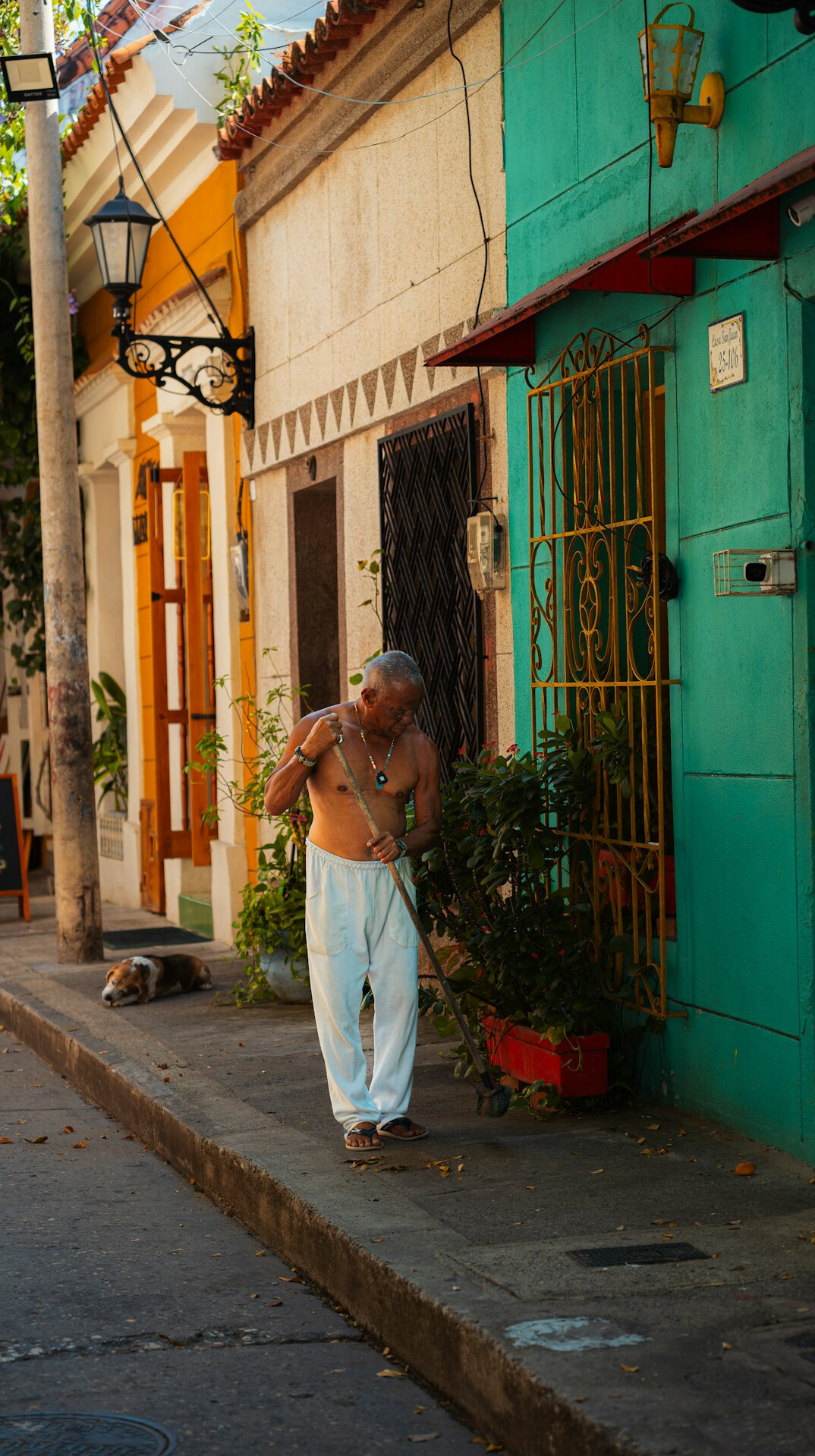 Portrait of an older Chilean man standing in a doorway
