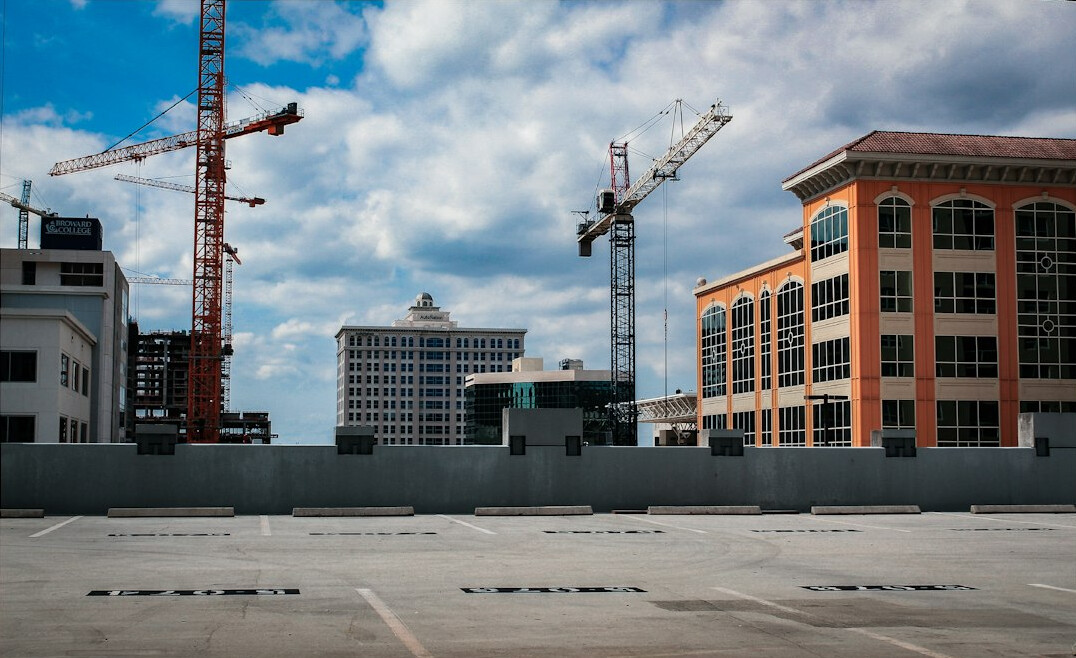 Construction site next to old buildings in a changing city block